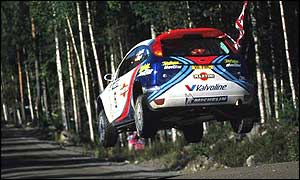 Colin McRae flies over a yump on the Rally of Finland
