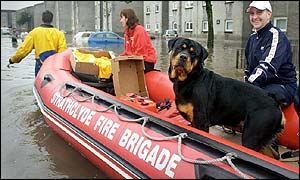 Man and dog in fire service inflatable