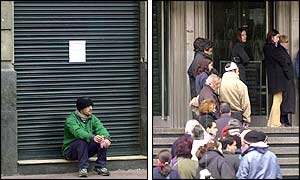 People wait outside cash machines