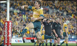 Mat Rogers celebrates scoring for Australia after 72 minutes