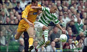 Celtic striker Henrik Larsson shields the ball against Dunfermline