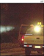 A truck sprays New York's Central Park in 2000