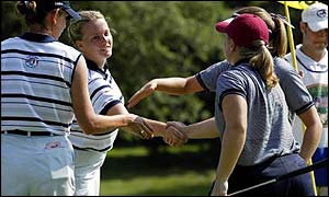 Meredith Duncan (red hat) and Angela Jerman claimed an early victory