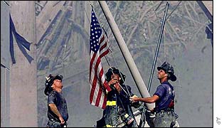 New York firefighters raising US flag