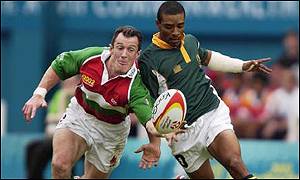 Rob Howley (left) in sevens action against South Africa