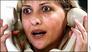 A trader at an exchange bureau in Sao Paulo, Brazil, 2 August 2002