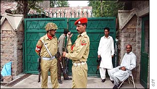 Pakistan army troopers stand guard at the main entrance of the Murree Christian School 