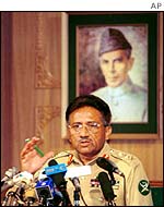 Musharraf under a portrait of Mohamed Ali Jinnah