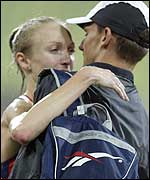 Paula Radcliffe gets a hug from husband Gary Lough