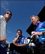Franchitti discusses tactics with his technical team