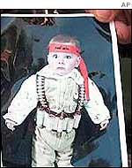A picture of a child with an ammunition belt and a Hamas head band found in a West Bank house in June