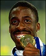 Dwain Chambers celebrates with his gold medal
