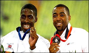 Great Britain's Dwain Chambers and Darren Campbell show off their gold and bronze medals respectively