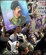 Crowd celebrating Saddam Hussein's birthday