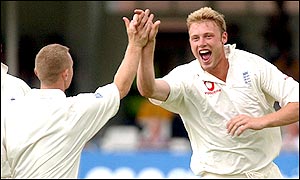 Flintoff enjoys the moment after he removes Laxman