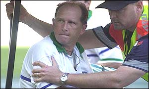 Irish referee David McHugh is carried off after being assaulted by a fan