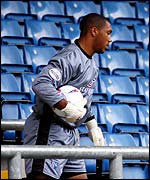 Gillingham goalkeeper Jason Brown retrieves the ball from the vacant stands 