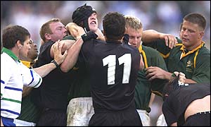 Players from both teams clash in the first half