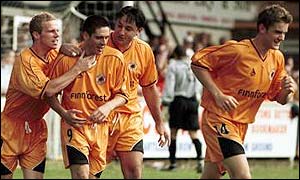 Daryl Clare (second left) is congratulated by his team-mates