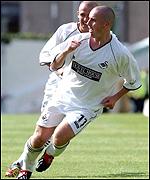 Paul Reid celebrates his first Swansea goal