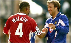 Paul Merson shakes Des Walkers hand after his first game for Portsmouth ends in victory