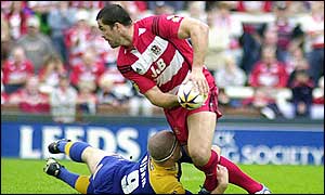 Wigan skipper Andy Farrell takes on the Leeds defence