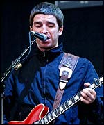 Noel Gallagher playing the guitar