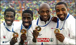 Christian Malcolm, Dwain Chambers, Marlon Devonish and Darren Campbell celebrate with their gold medals 