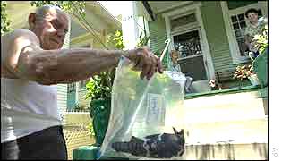 Man shows dead bird at his home in Louisiana