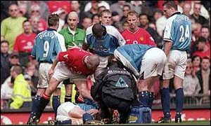 Keane shouts at Haaland (on ground) after the tackle