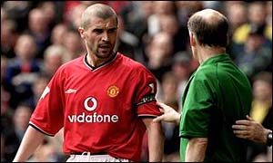 Referee David Elleray calls Keane over after his tackle on Alf-Inge Haaland