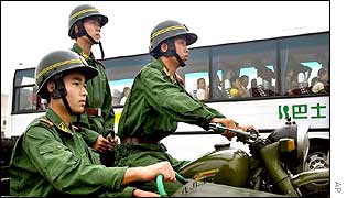 Soldiers evacuate a bus-load of civilians during the drill