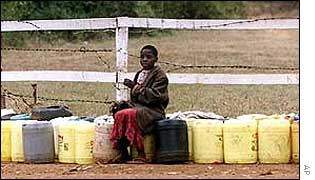 Kenyan child with water containers AP