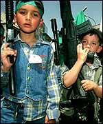 Palestinian boys with guns