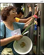 Demonstrators banging on a bank door in Buenos Aires