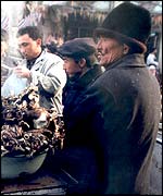 Uighurs at a market stall