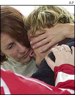 Austrian evacuees comfort each other with Red Cross help