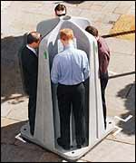 Men in portable urinal, WCC photo