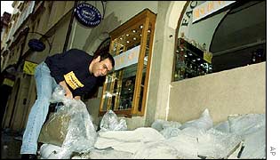 Restaurant owner in Prague places sandbags outside his business