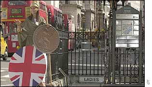 Britannia posing with a giant penny 