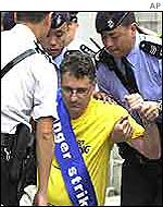 Falun Gong member being arrested