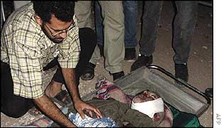 Jarrar's remains are examined by a relative