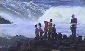 Children pose for a picture with a parent 