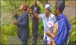 Herve Bola's family hold prayes at the pool where he drowned