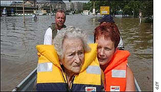 Elderly woman being evacuated