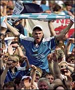 Manchester City fans celebrate promotion to the Premiership