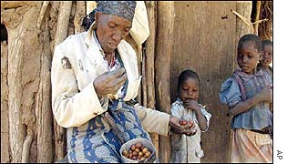 Woman eats masau wild fruit