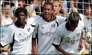 Rufus Brevett, Steve Marlet and Louis Saha celebrate Marlet's penalty