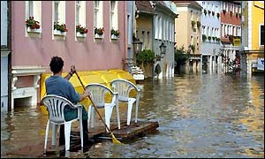 A man negotiates Meissen, near Dresden, in a makeshift raft