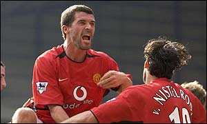 Roy Keane celebrates Manchester United's goal against West Brom